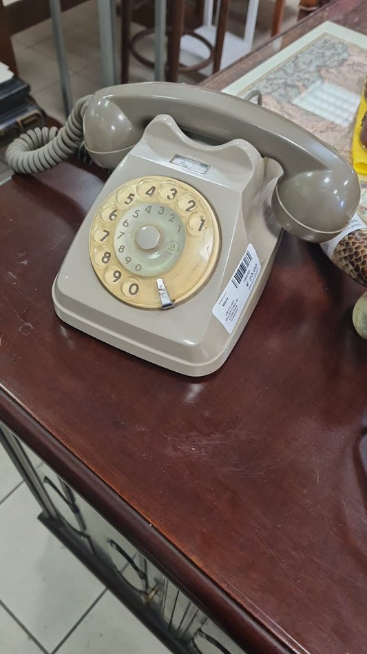 Vecchio telefono a corona grigio